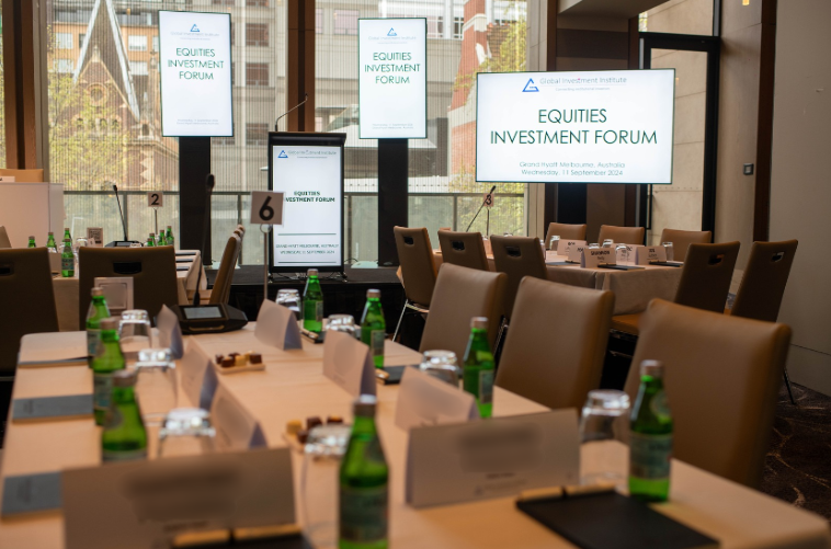 Conference room setup for the Equities Investment Forum, featuring multiple screens, microphones, and professional AV equipment.