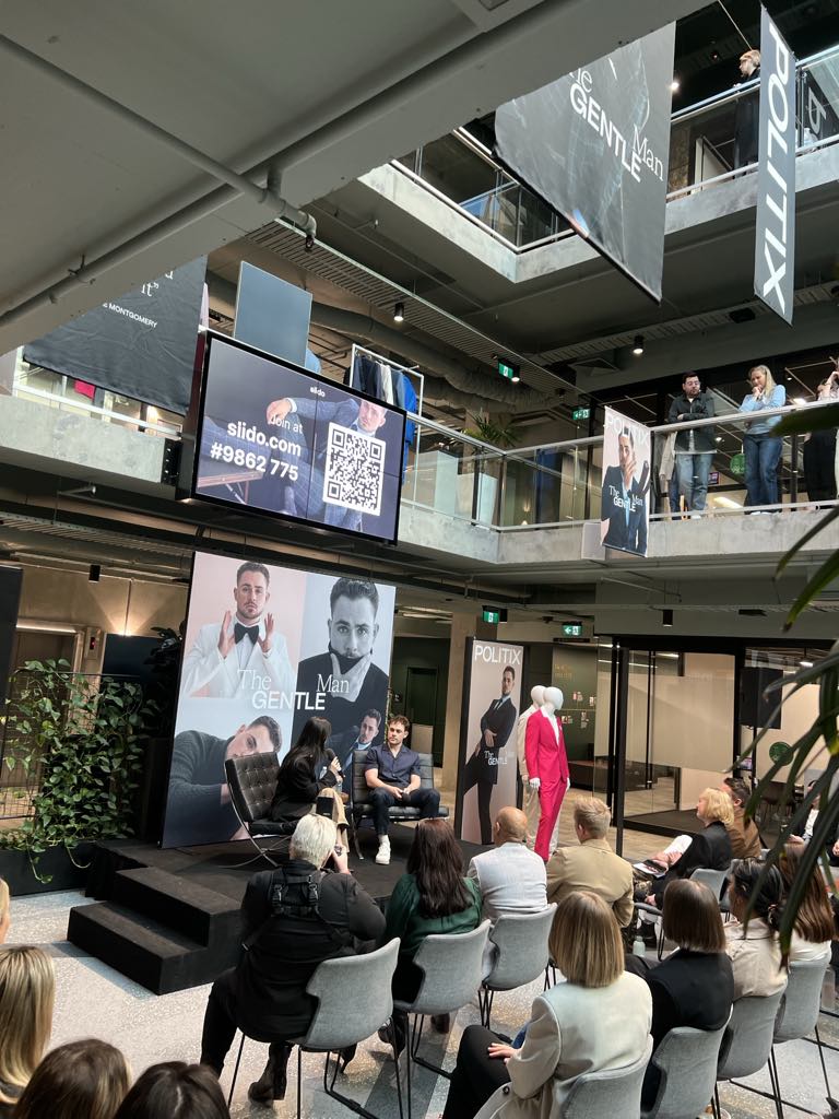 Minimalist stage and lighting design at POLITIX campaign launch event