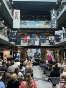 Presentation stage with audience at a corporate event.