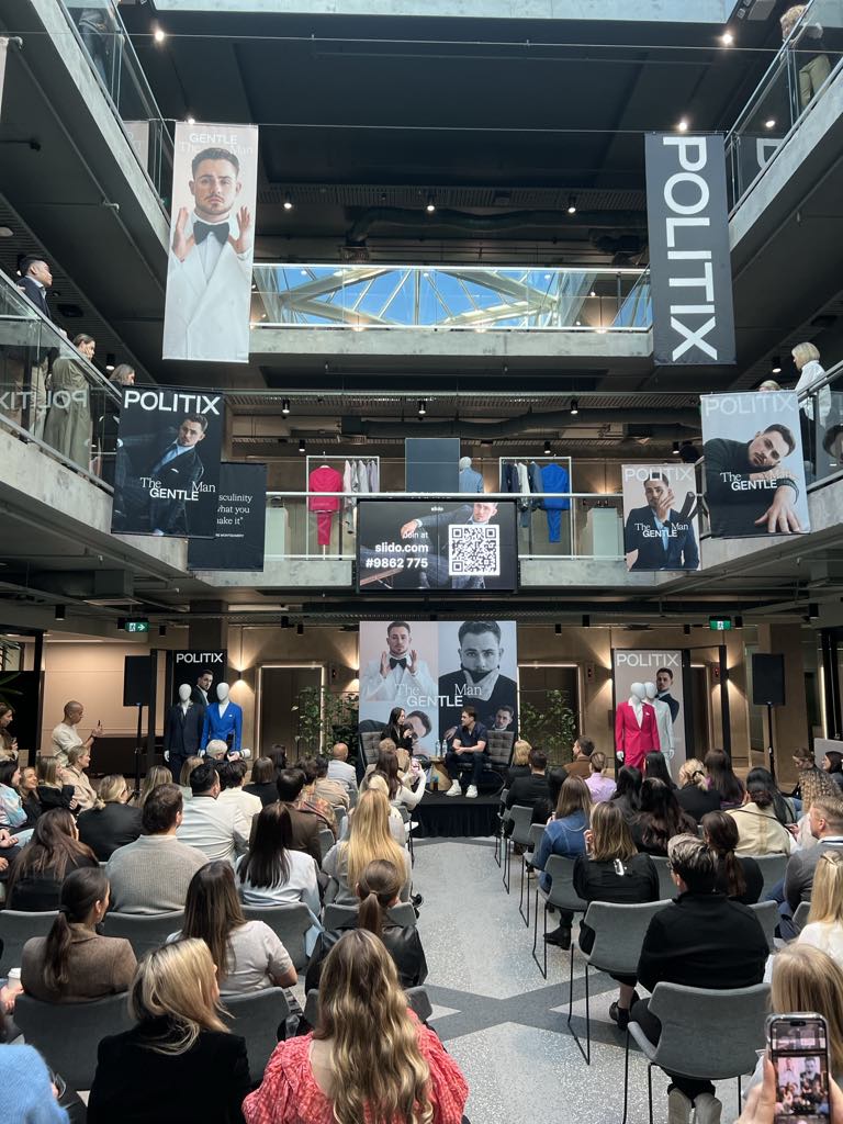 Presentation stage with audience at a corporate event.