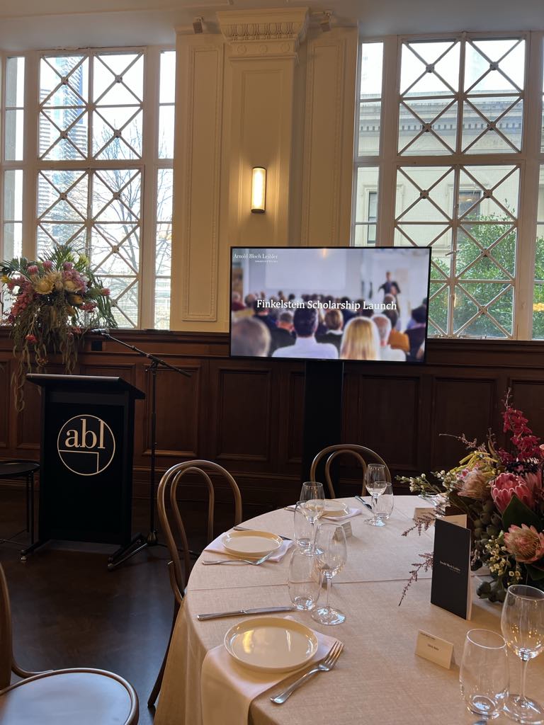 Discreet AV equipment and projection screens at corporate event in Melbourne